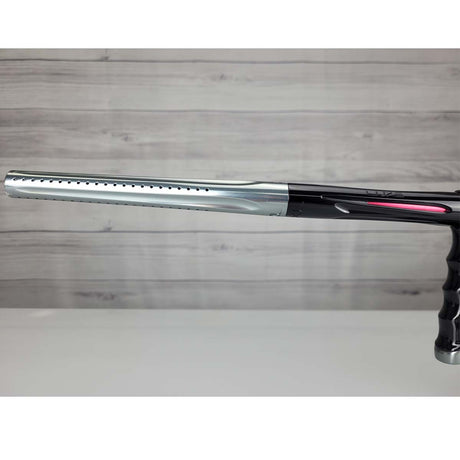 Left side barrel USED DLX Luxe X Silver Black on a panel background.
