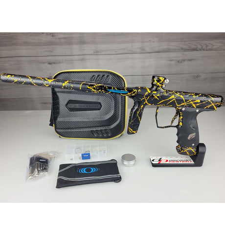 USED HK Army Shocker AMP Prestige Black Gold Splash on a woodgrain background with case and accessories