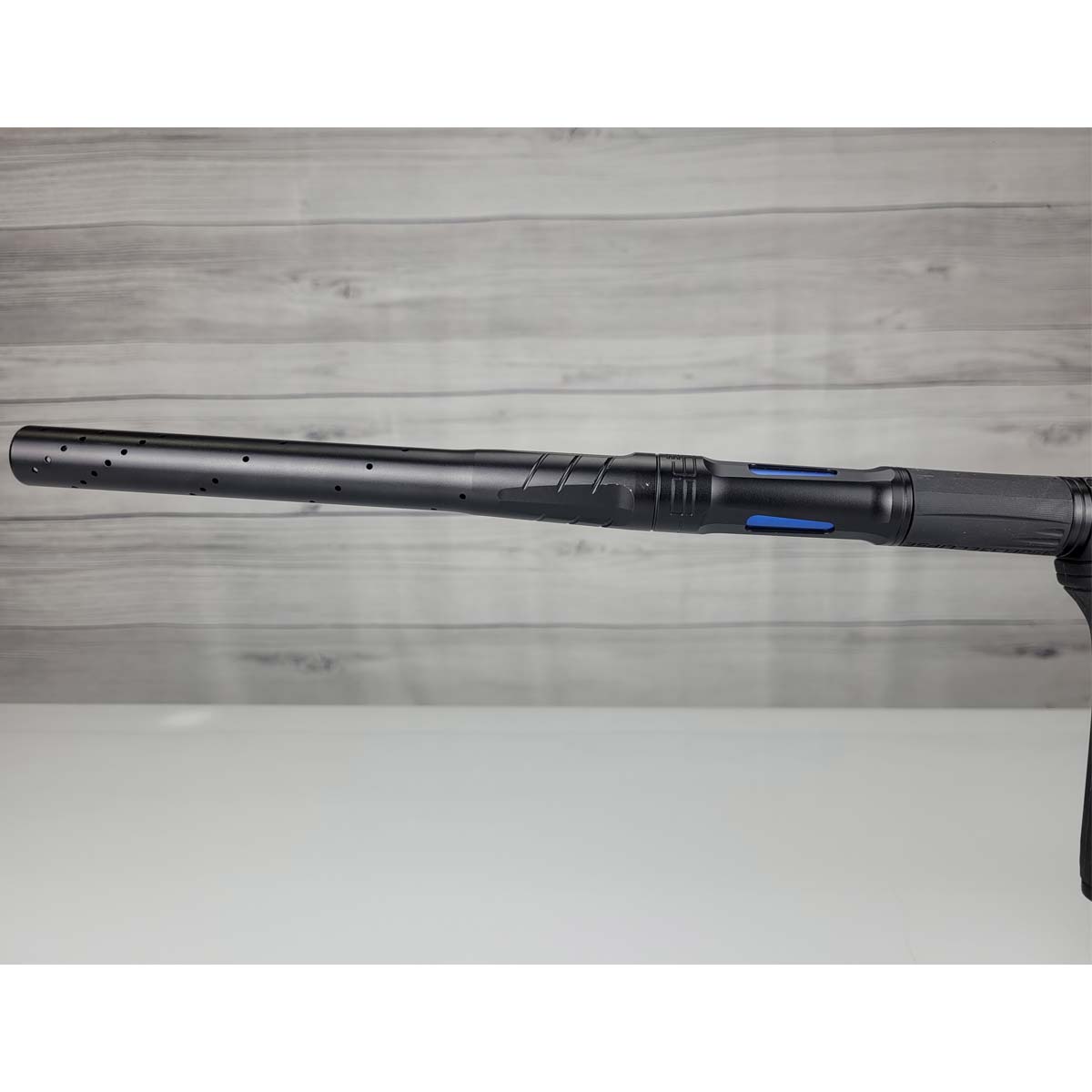 Left side barrel USED Planet Eclipse CS3 Midnight Black on a woodgrain background