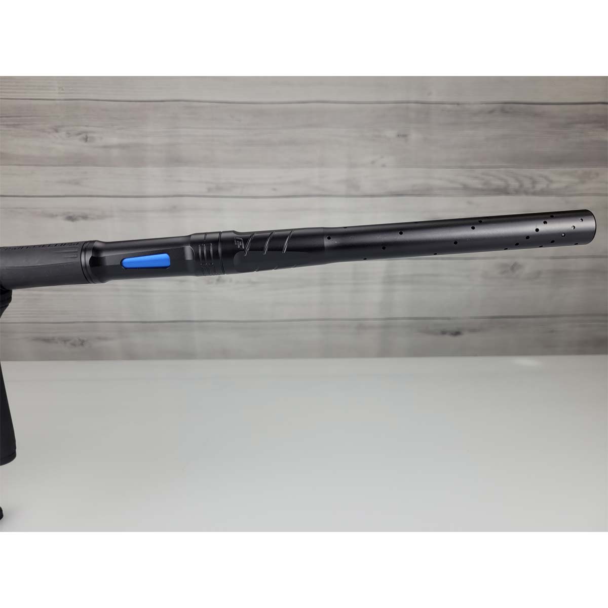 Right side barrel USED Planet Eclipse CS3 Midnight Black on a woodgrain background