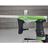 Left side body Green and silver USED Planet Eclipse Geo 3.5 Kyrpton Ice Green Silver paintball marker on a wood panel background.