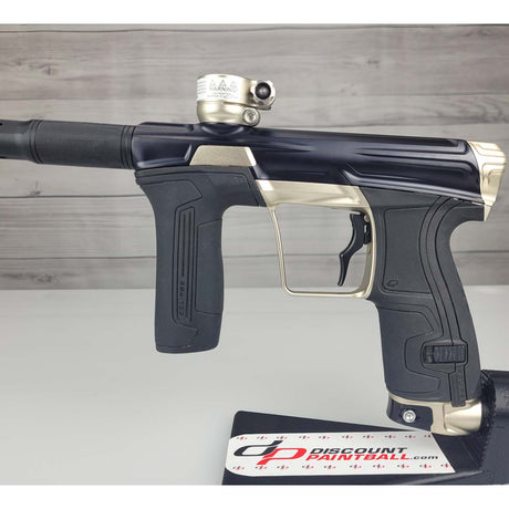 Left side body USED Planet Eclipse CS2 Paintball Marker Black Sandstone on a white surface and wooden background