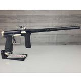 Right side USED Planet Eclipse CS2 Paintball Marker Black Sandstone on a white surface and wooden background