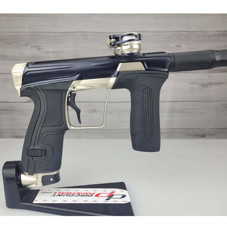 Right side body USED Planet Eclipse CS2 Paintball Marker Black Sandstone on a white surface and wooden background