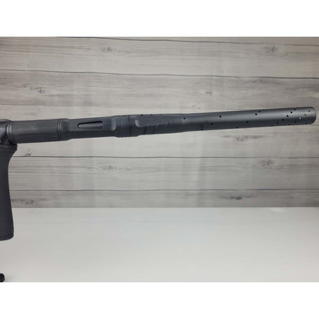 Right side barrel USED Planet Eclipse CS2 Paintball Marker Black Sandstone on a white surface and wooden background