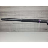 Left side barrel USED Planet Eclipse CS2 Paintball Marker Black Purple Grey Splash on a woodgrain background