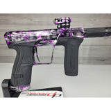Right side body USED Planet Eclipse CS2 Paintball Marker Black Purple Grey Splash on a woodgrain background
