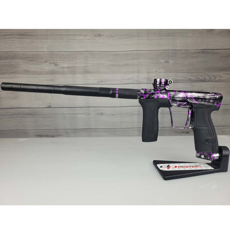 Left side USED Planet Eclipse CS2 Paintball Marker Black Purple Grey Splash on a woodgrain background