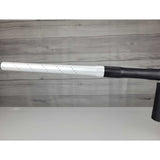 Left side barrel USED Shocker Era Silver black paintball marker in a stand on a woodgrain background.