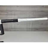 Right side barrel USED Shocker Era Silver black paintball marker in a stand on a woodgrain background.