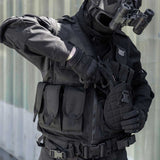 black BSX Crossdraw Vest for for airsoft and paintball, shown on a person wearing tactical gear