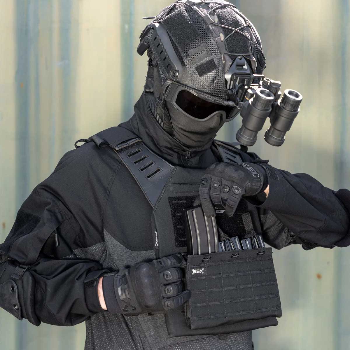 Front angle of black BSX Plate Carrier LC  for airsoft and paintball with mags on a person dressed in tactical gear