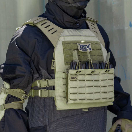 Front angle of olive green BSX Plate Carrier LC  for airsoft and paintball with mags on a person dressed in tactical gear and black gloves