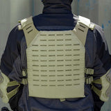 Back of olive green BSX Plate Carrier LC  for airsoft and paintball with mags on a person dressed in tactical gear and black gloves