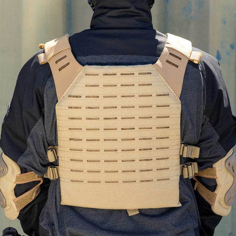 Back of tan BSX Plate Carrier LC  for airsoft and paintball with mags on a person dressed in tactical gear