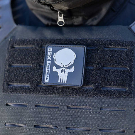 Patch area of black HK Army BSX Skull Plate Carrier for molle attachments for airsoft and paintball, shown on a person