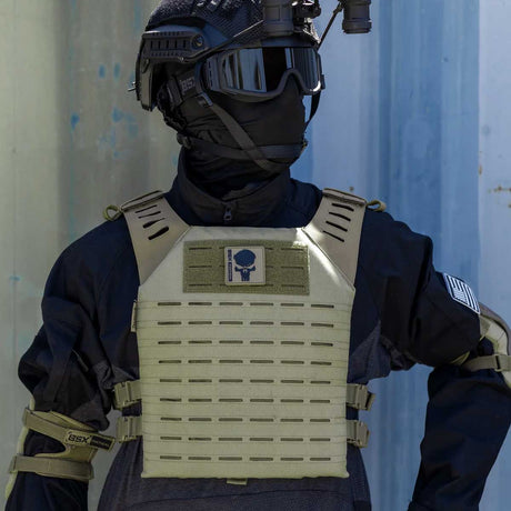 Front of olive green HK Army BSX Skull Plate Carrier for molle attachments for airsoft and paintball, shown on a person in tactical attire