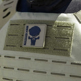 Close up patch detail olive green HK Army BSX Skull Plate Carrier for molle attachments for airsoft and paintball, shown on a person in tactical attire