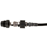 black HK Army Remote Coiled Hose Line With Slide Check adapter end for paintball and airsoft air systems photographed on a plain white background.
