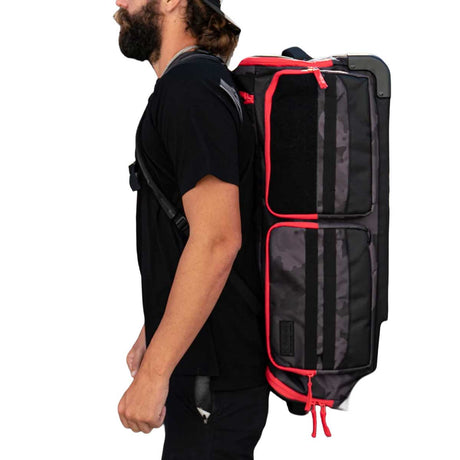 Person wearing Black and red with red logo HK Army Paintball Expand 75L Roller Gear bag Shroud Black Red as a backpack on a white background