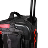 Close of handle and corner of HK Army Paintball Expand 75L Roller Gear bag Shroud Black Red on a white background