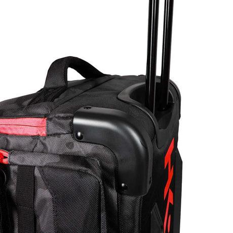 Close of handle and corner of HK Army Paintball Expand 75L Roller Gear bag Shroud Black Red on a white background