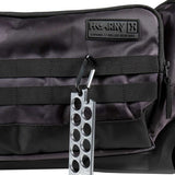 Close up of the molle straps on a black and grey camo HK Army Expand 75L Roller Gear Bag Shroud Blackout against a white background