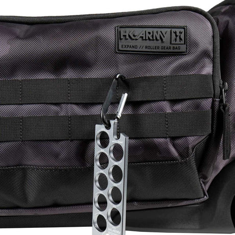 Close up of the molle straps on a black and grey camo HK Army Expand 75L Roller Gear Bag Shroud Blackout against a white background