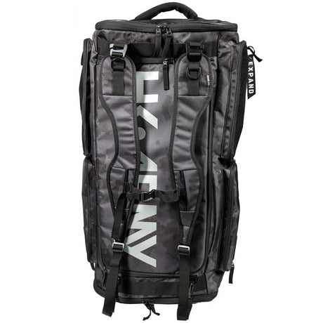 Back of a black and grey camo HK Army Expand 75L Roller Gear Bag Shroud Blackout against a white background