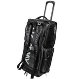 A black and gray HK Army Expand 75L Roller Gear Bag Shroud Blackout rolling duffel bag with an extended telescoping handle, multiple zippered compartments, and a vertical white HK Army brand logo on the side, shown against a plain white background.