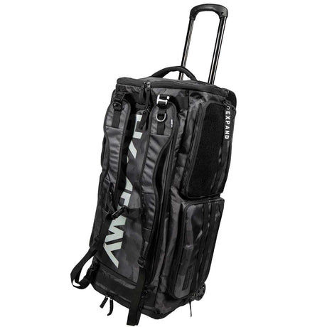 A black and gray HK Army Expand 75L Roller Gear Bag Shroud Blackout rolling duffel bag with an extended telescoping handle, multiple zippered compartments, and a vertical white HK Army brand logo on the side, shown against a plain white background.