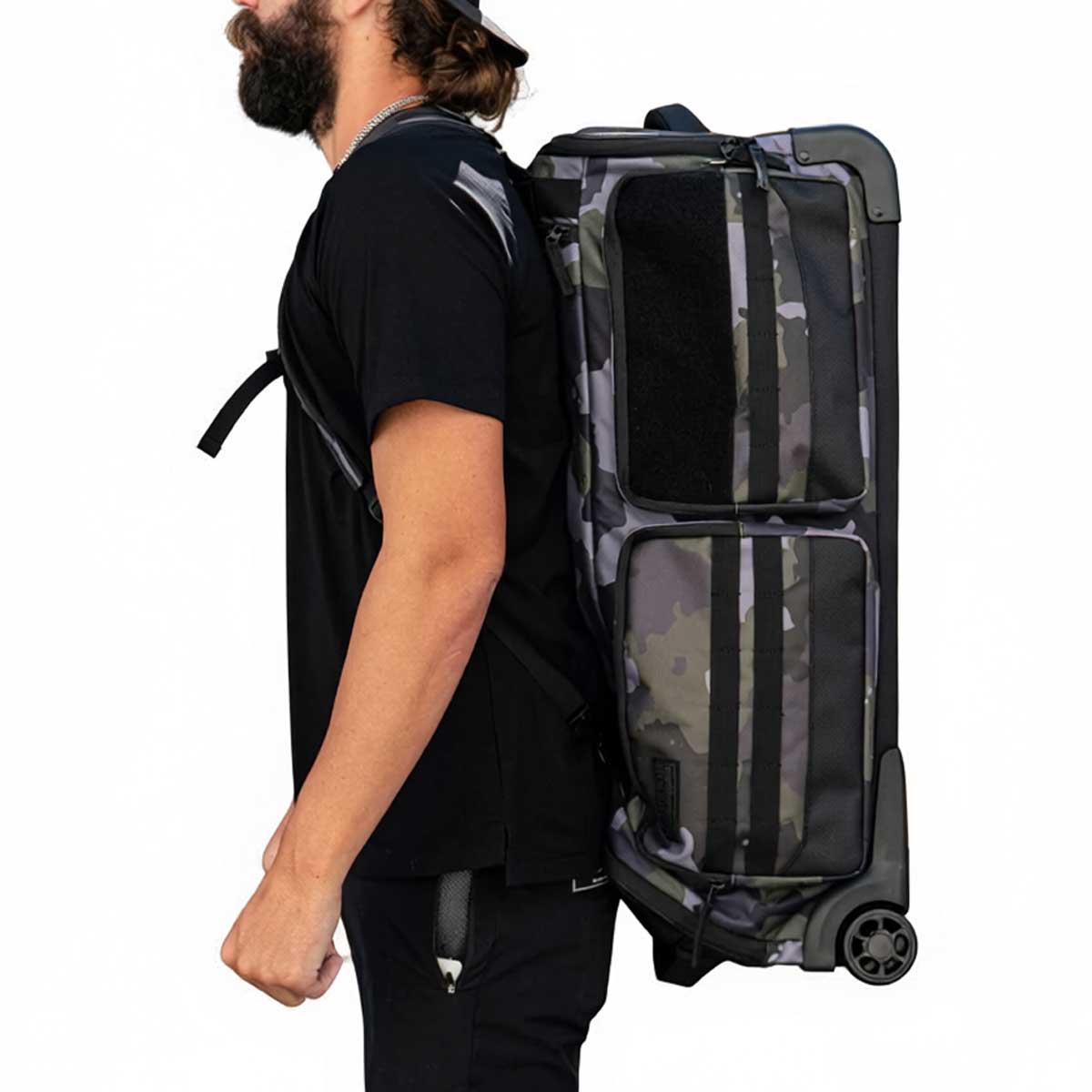 Black green and grey camo print with white logo HK Army Paintball Expand 75L Roller Gear bag Shroud Forest on a person on a white background