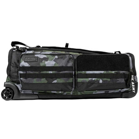 Side view Back of Black green and grey camo print with white logo HK Army Paintball Expand 75L Roller Gear bag Shroud Forest with handle and wheels on a white background