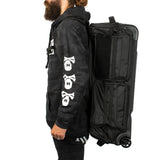 All Black with white logo HK Army Paintball Expand 75L Roller Gearbag Stealth being worn as a backpack on a person on a white background.