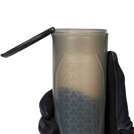 One open HK Army Apex 150 Round Paintball Pod in Light Smoke color being held in by a gloved hand on a white background