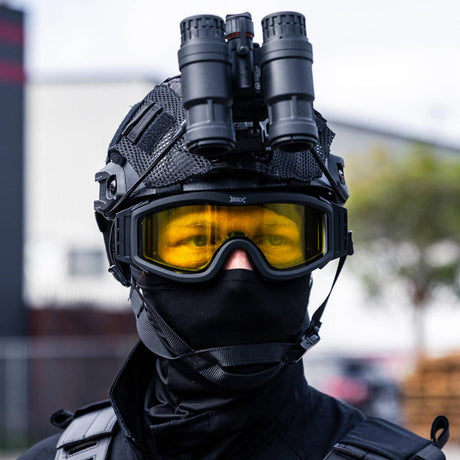 BSX Tango Airsoft Thermal Goggle with Multiple Lens shown with yellow lens installed on a person dressed in black tactical attire.