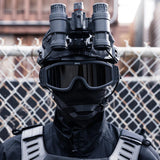 HK Army BSX Tango Airsoft Thermal Goggle with Multiple Lens shown with smoke lens installed on a person dressed in black tactical attire.