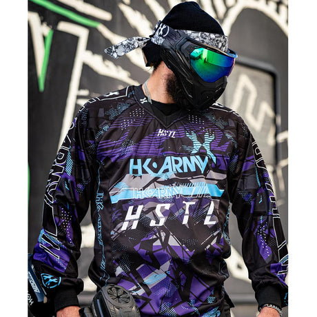 Purple, blue and Black HK Army HSTL Artic long sleeve Jersey on a person on a busy background