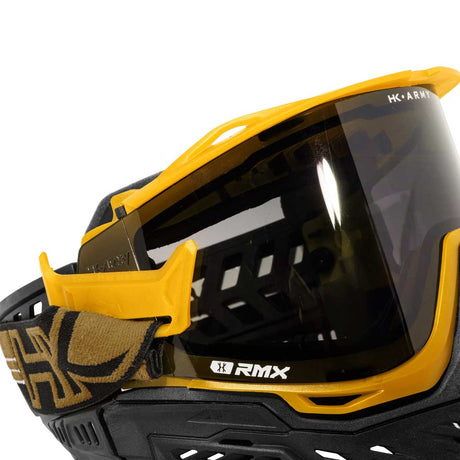 Side view of strap attachment HK Army RMX Thermal Paintball Goggles Black yellow Gold with smoke lens on a white background
