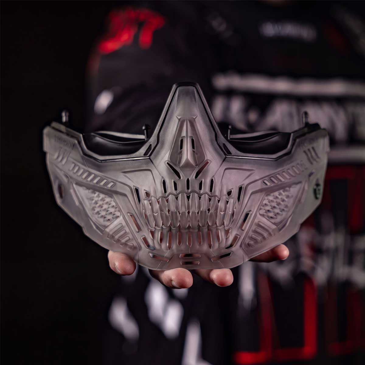 HK Army RMX Lower Terror Ghost Series Goggle Skirt Smoke being held on a hand on a dark background