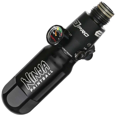 A black anodized aluminum Ninja Pocket Bottle 4500psi Reg Tester with white 'NINJA PAINTBALL' branding installed on a Empire FLO reg shown on a plain white background.