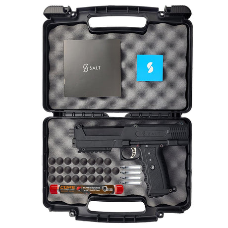 Salt Supply S1 Pepperball Pistol black in a foam lined case with hard rubber rounds, co2 cartridges and a tube of pepper projectiles on a white background