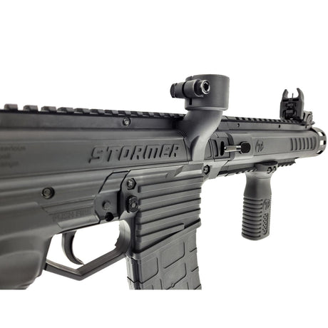 Close up Right rear angle with hopper adapter Tippmann Stormer Elite Dual Feed Paintball Marker Black on a white background