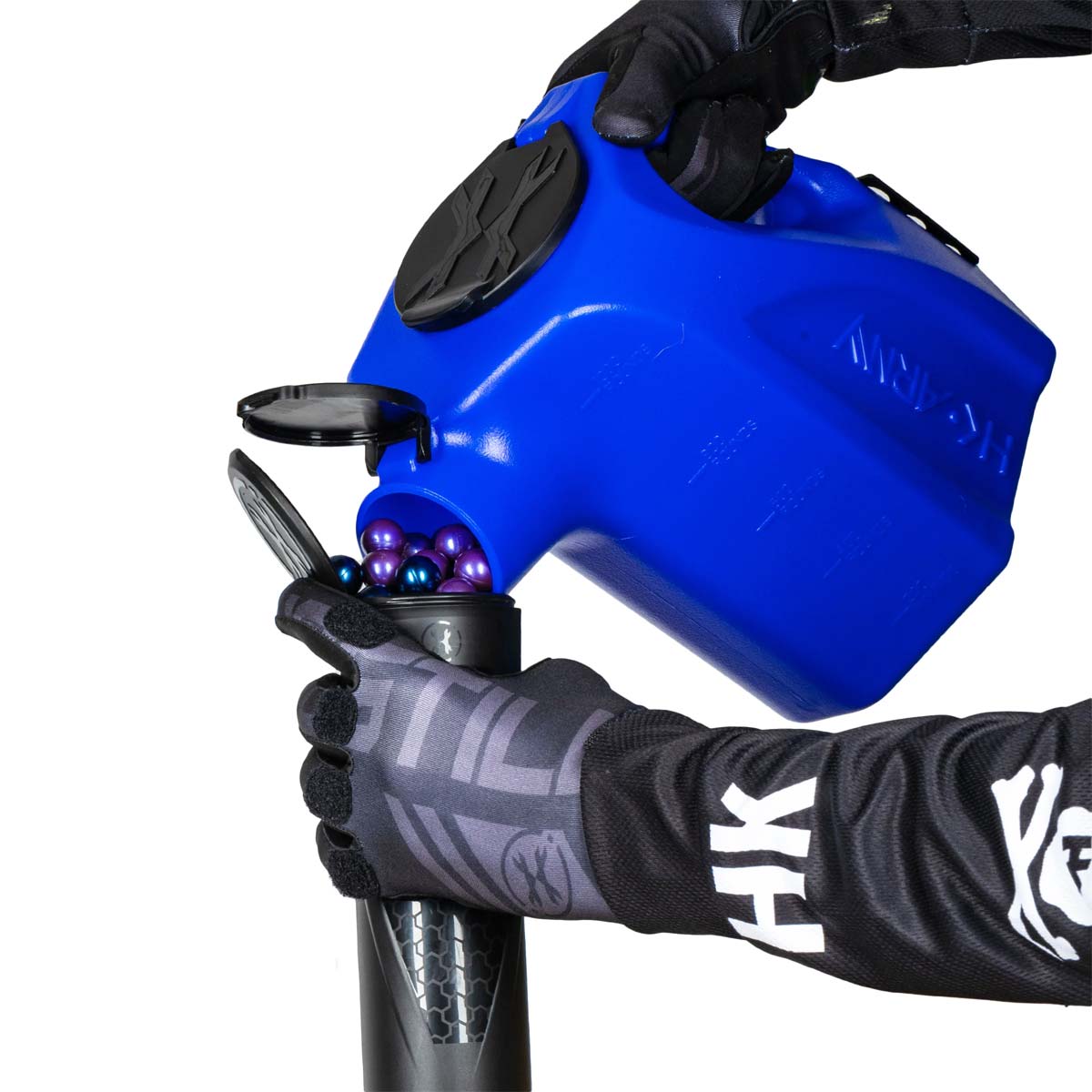 Blue plastic HK Army Reload Paintball Hauler Caddy for loading paintballs into pods and hoppers being used to fill a pod.