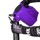 Purple  plastic HK Army Reload Paintball Hauler Caddy loading paintballs into a pod.
