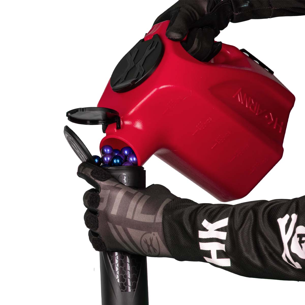 red plastic HK Army Reload Paintball Hauler Caddy loading paintballs into a pod.