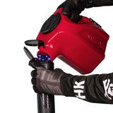 red plastic HK Army Reload Paintball Hauler Caddy loading paintballs into a pod.