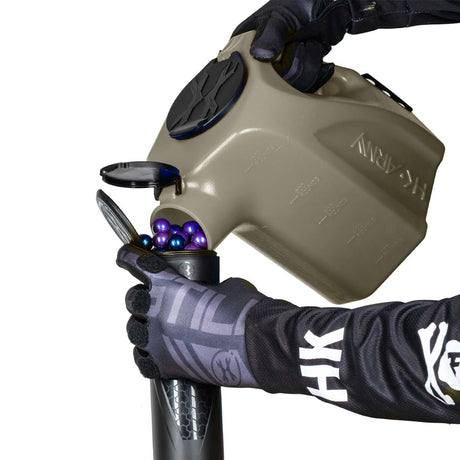light smoke plastic HK Army Reload Paintball Hauler Caddy loading paintballs into a pod.
